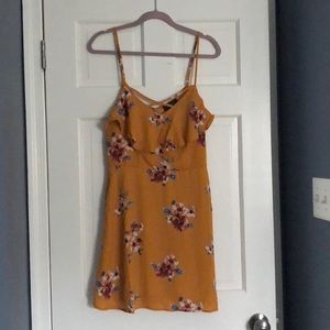 Francesca’s yellow floral dress
